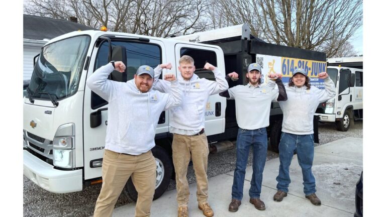 junk removal crew in front of junk removal dump trucks